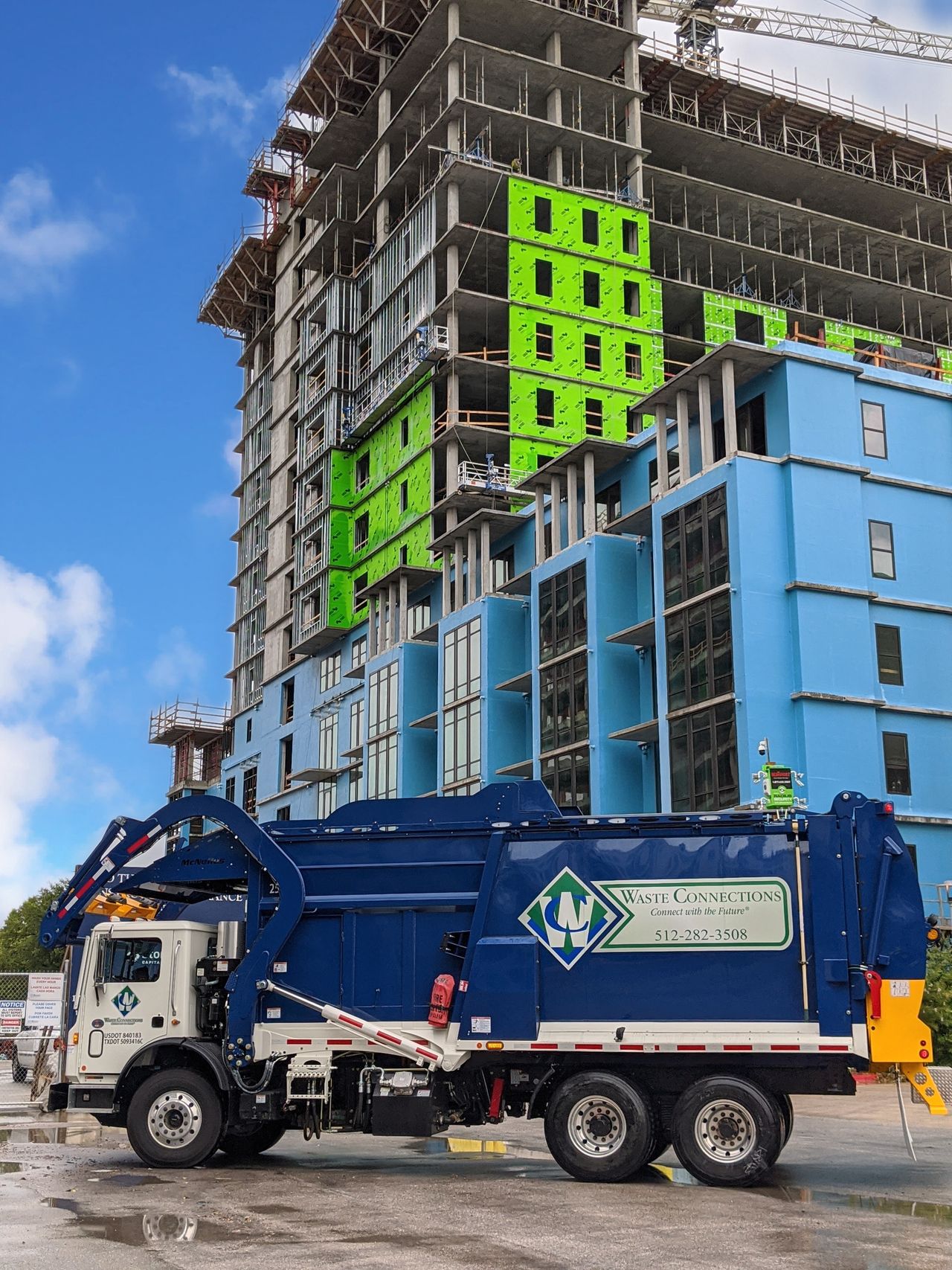 Commercial waste and dumpster behind office building