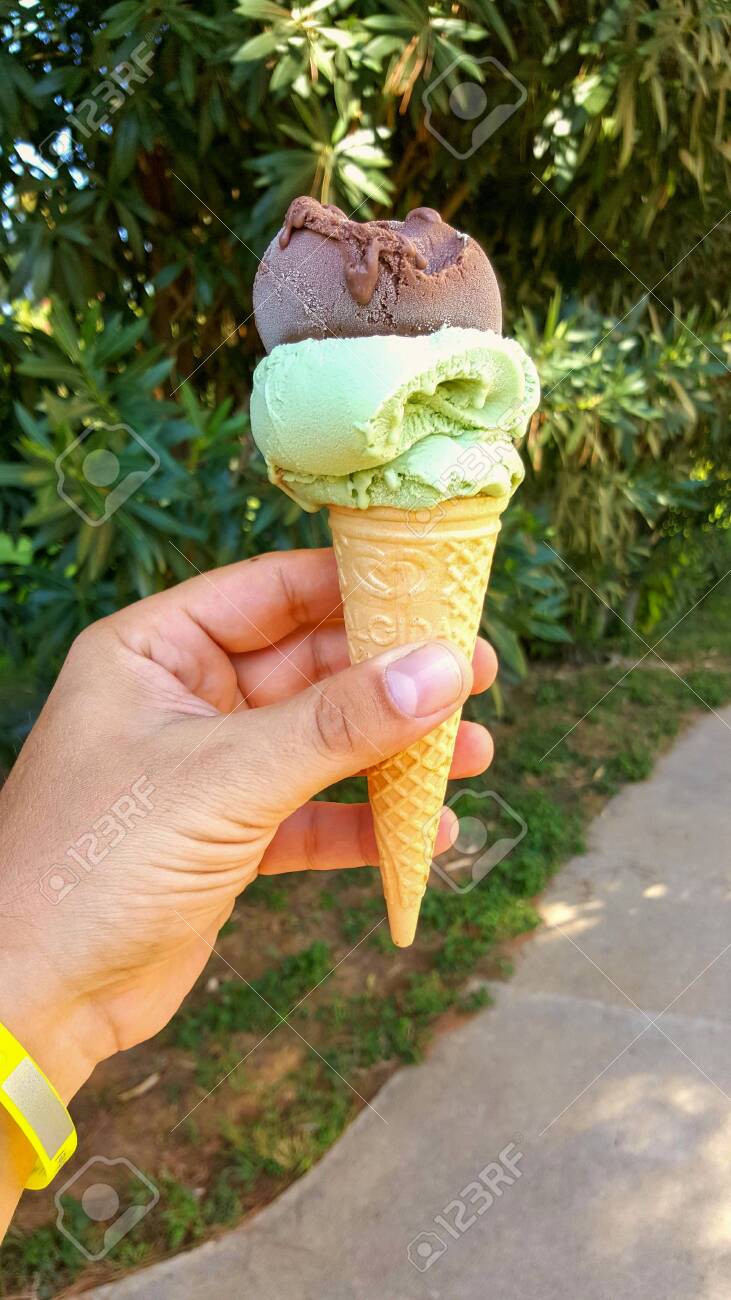 Twin gelato cones against a summer sky