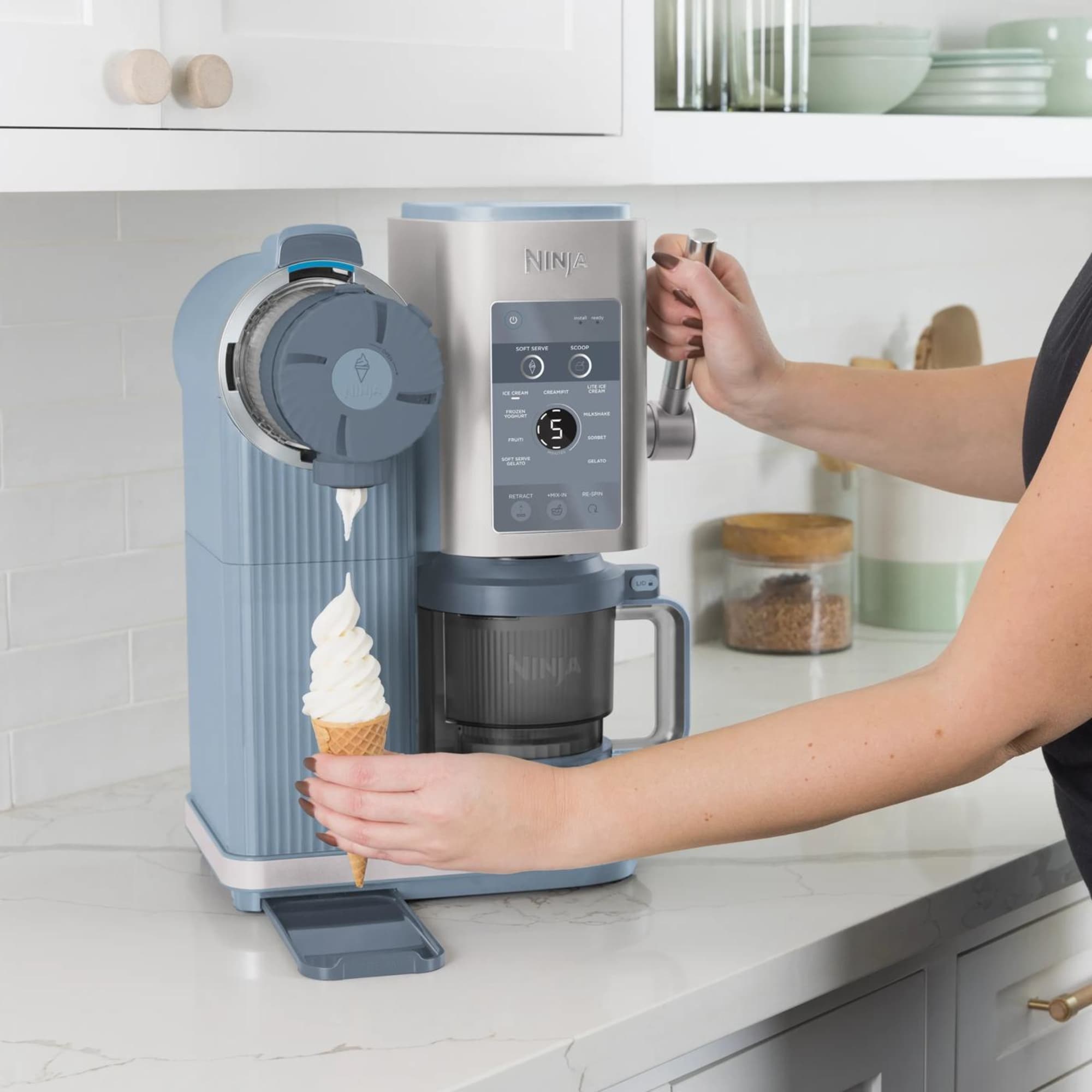 A gelato maker scooping fresh gelato into a cone