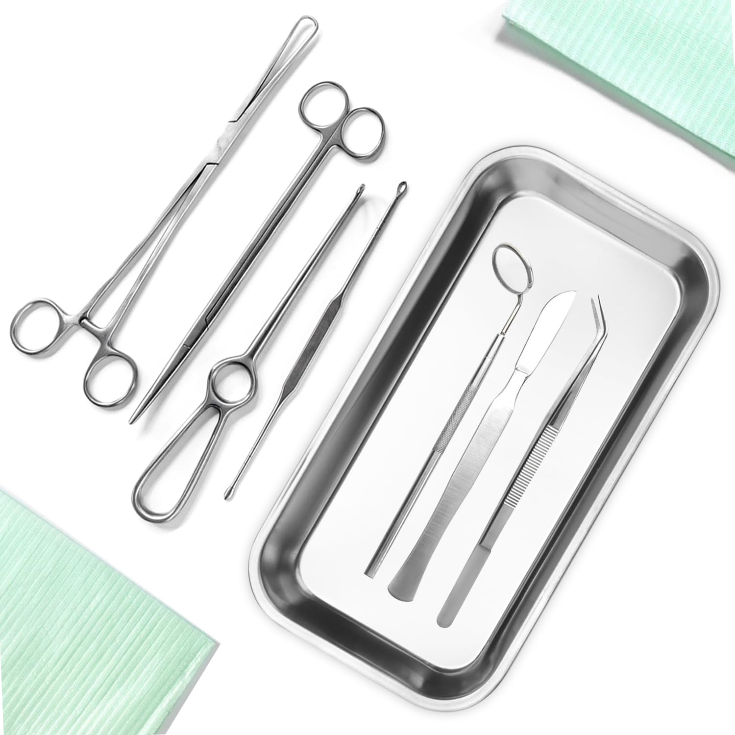 Stainless steel surgical instruments arranged on a clinical surface