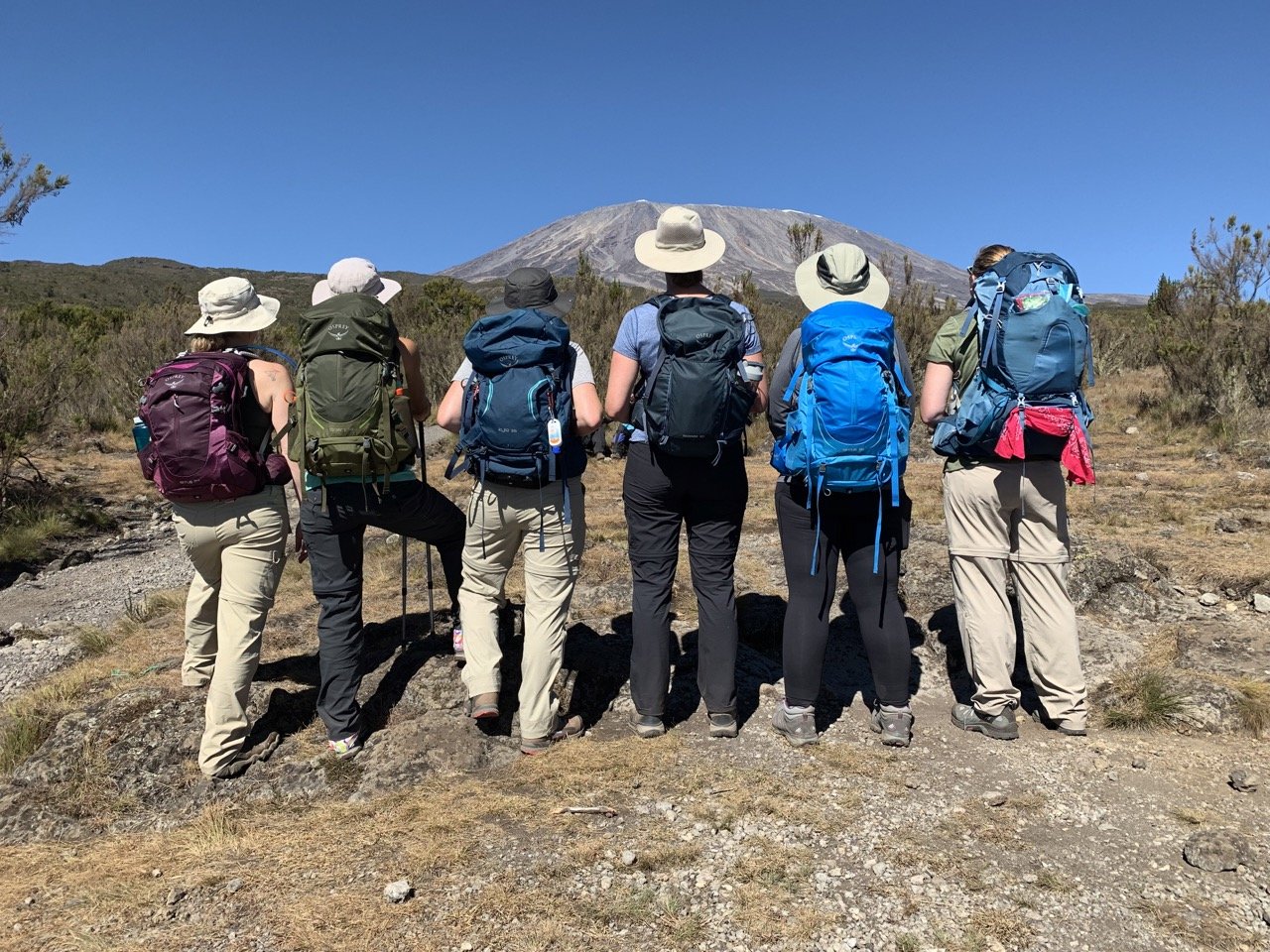 A porter carrying kit along the trail