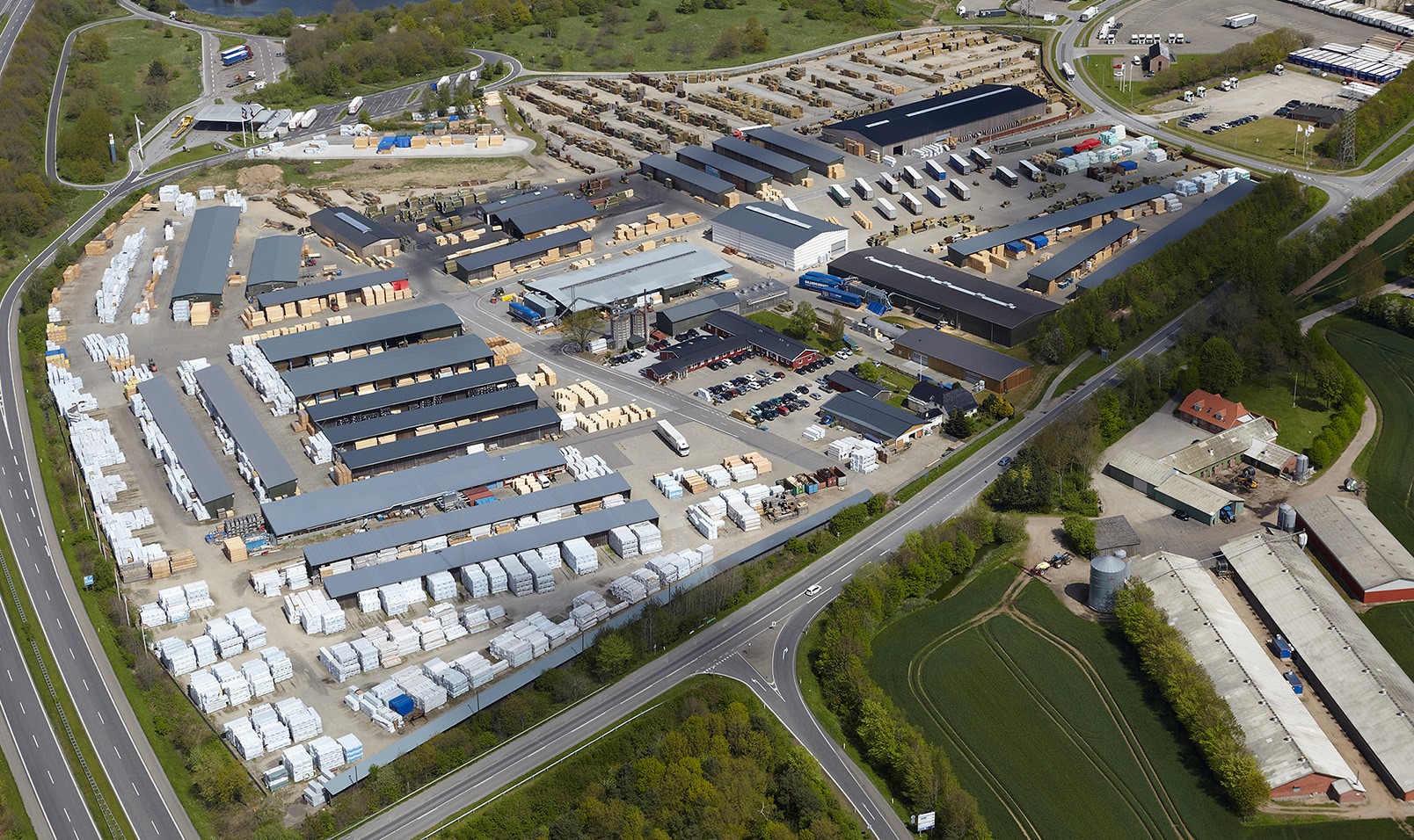 Aerial view of industrial timber warehouse complex in Denmark