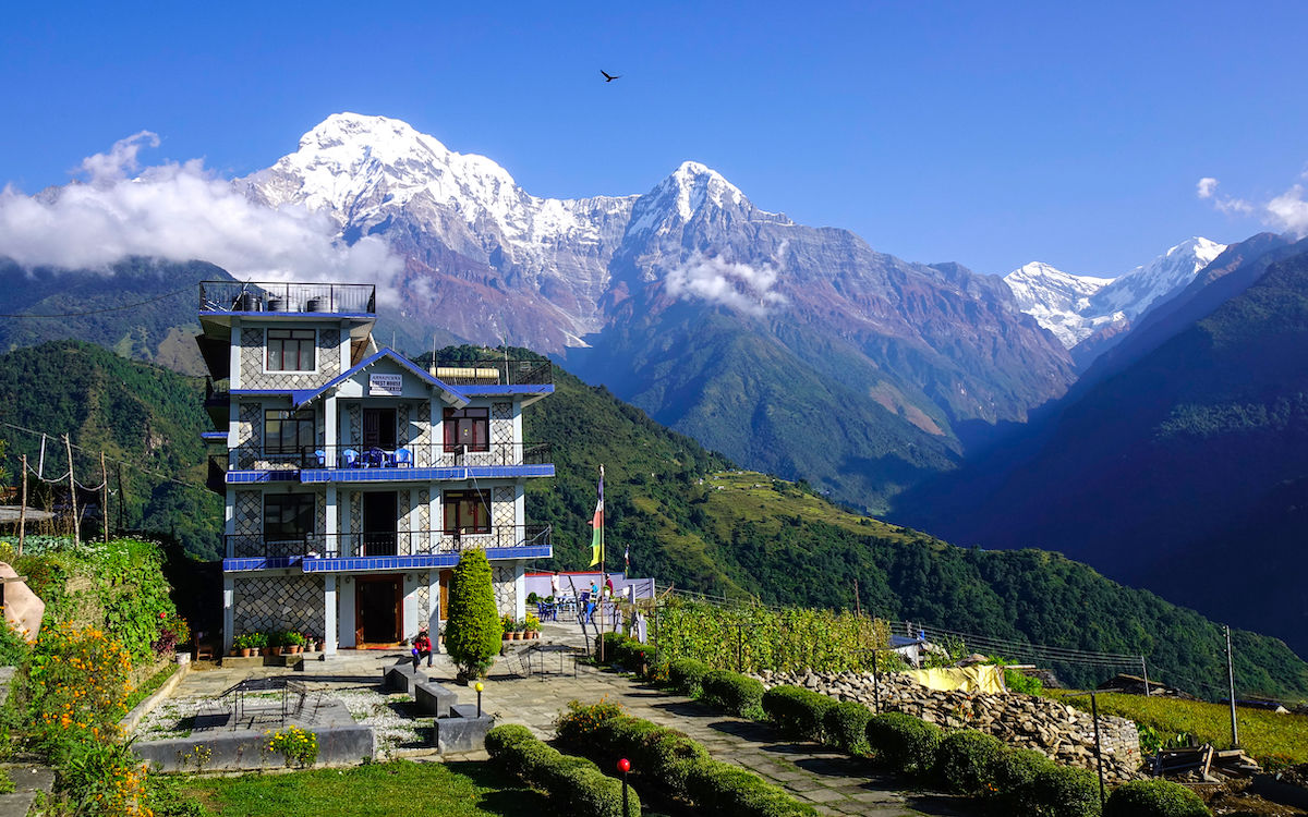 A teahouse room at Dingboche — bed, blanket, and that's the point.
