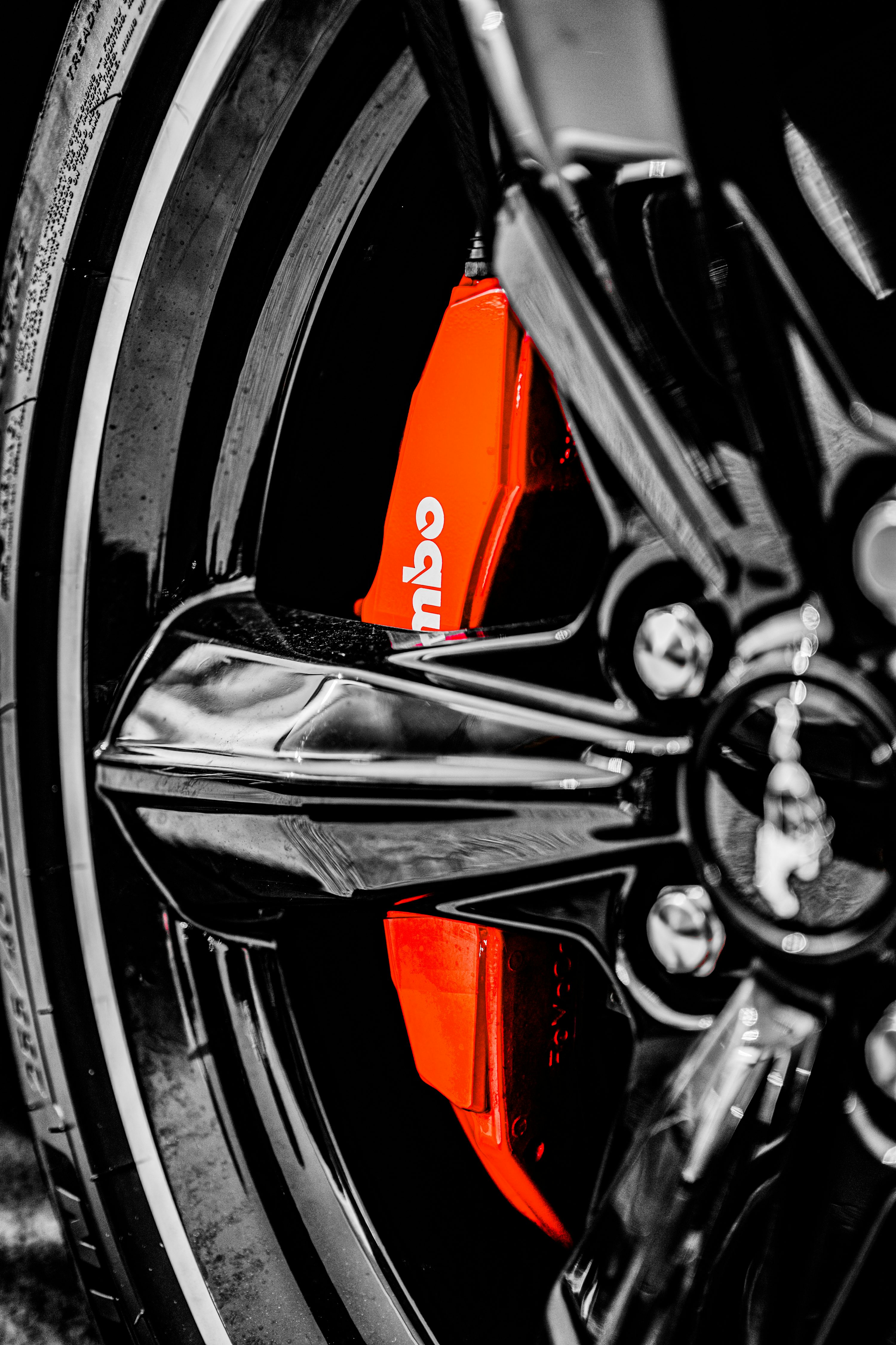Car brake disc and caliper close-up during a brake pad replacement service
