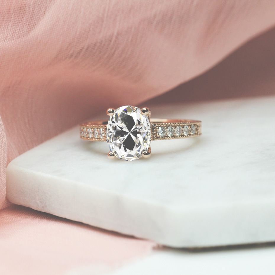 Margot pavé diamond band in rose gold resting on white linen