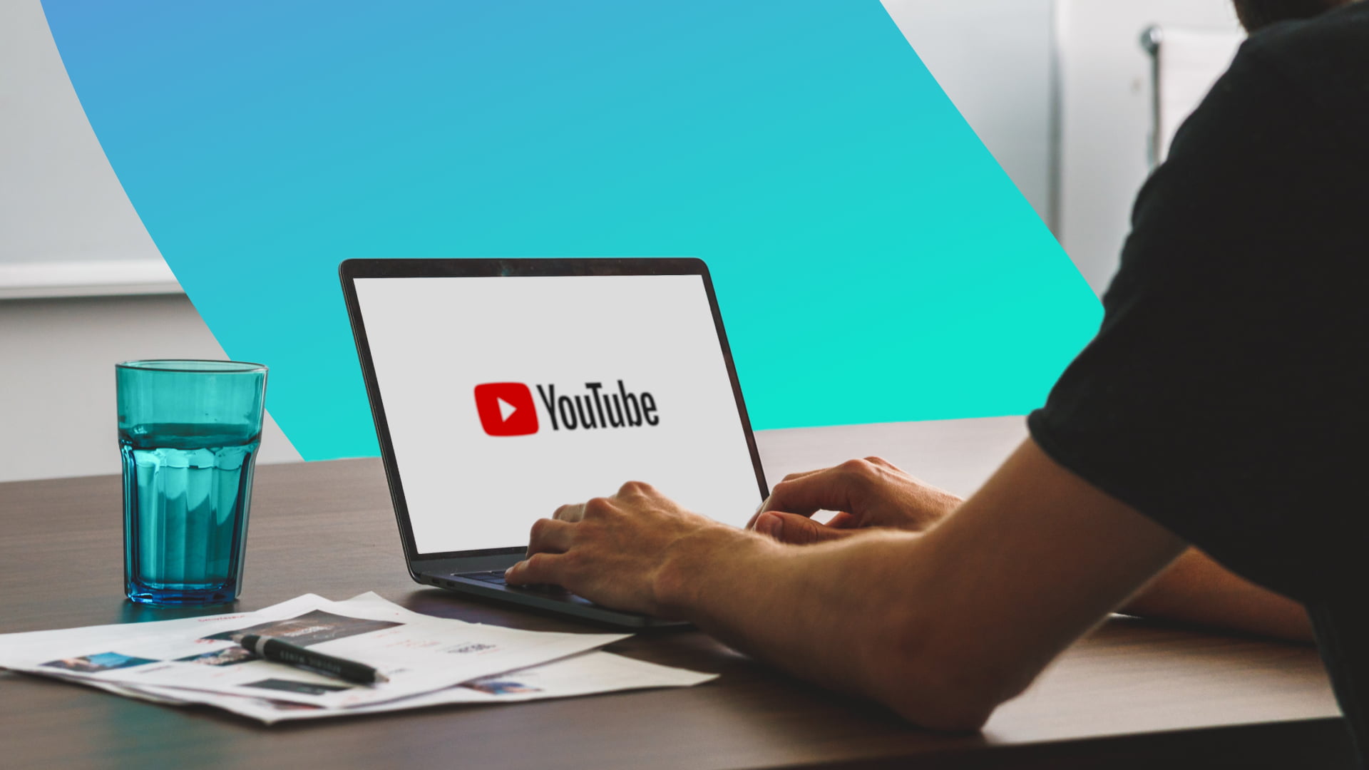 A viewer watching a video advertisement on a laptop, pausing to judge whether the AI ad is believable