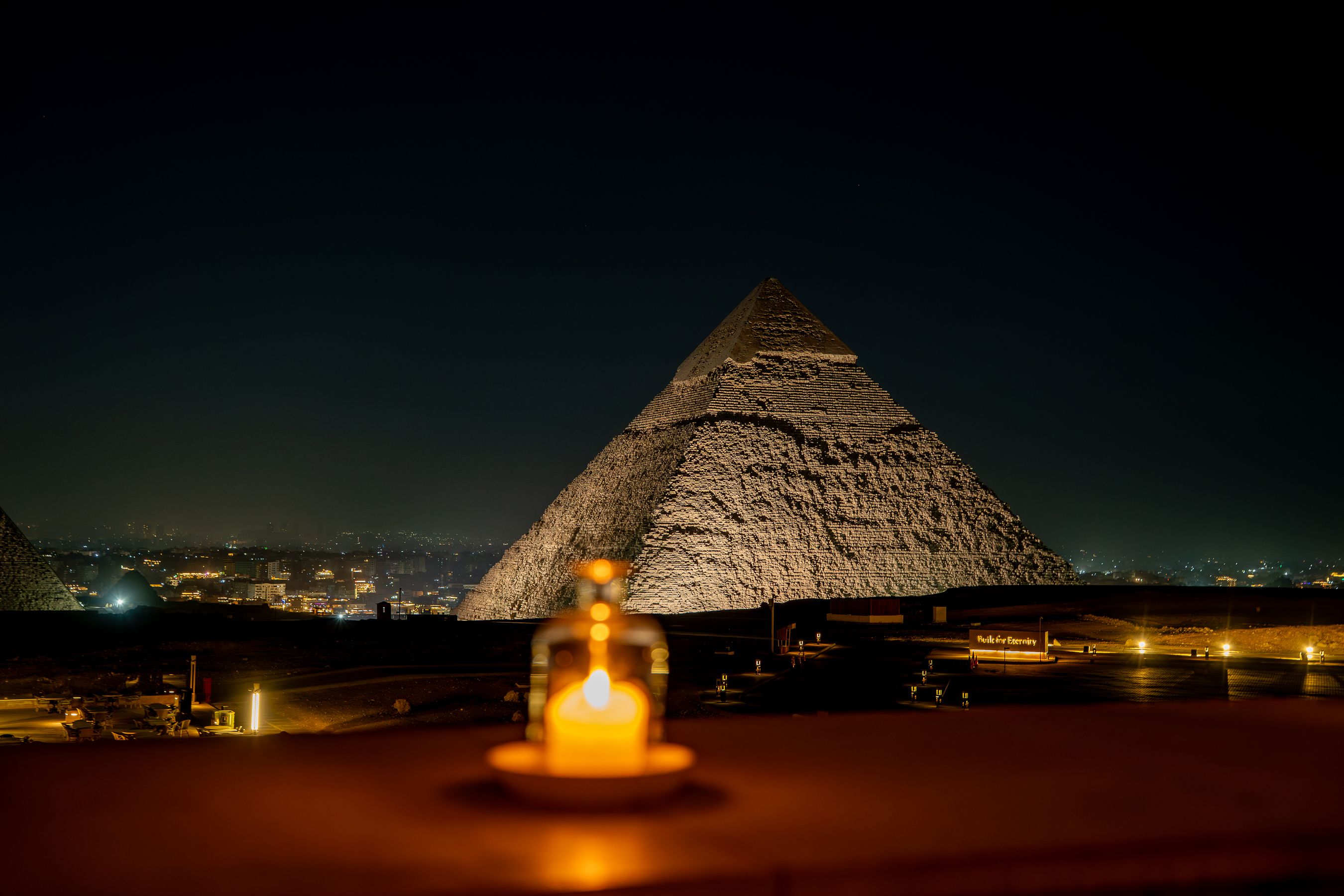 The Pyramids of Giza and the Great Sphinx at golden hour on Cairo's desert edge
