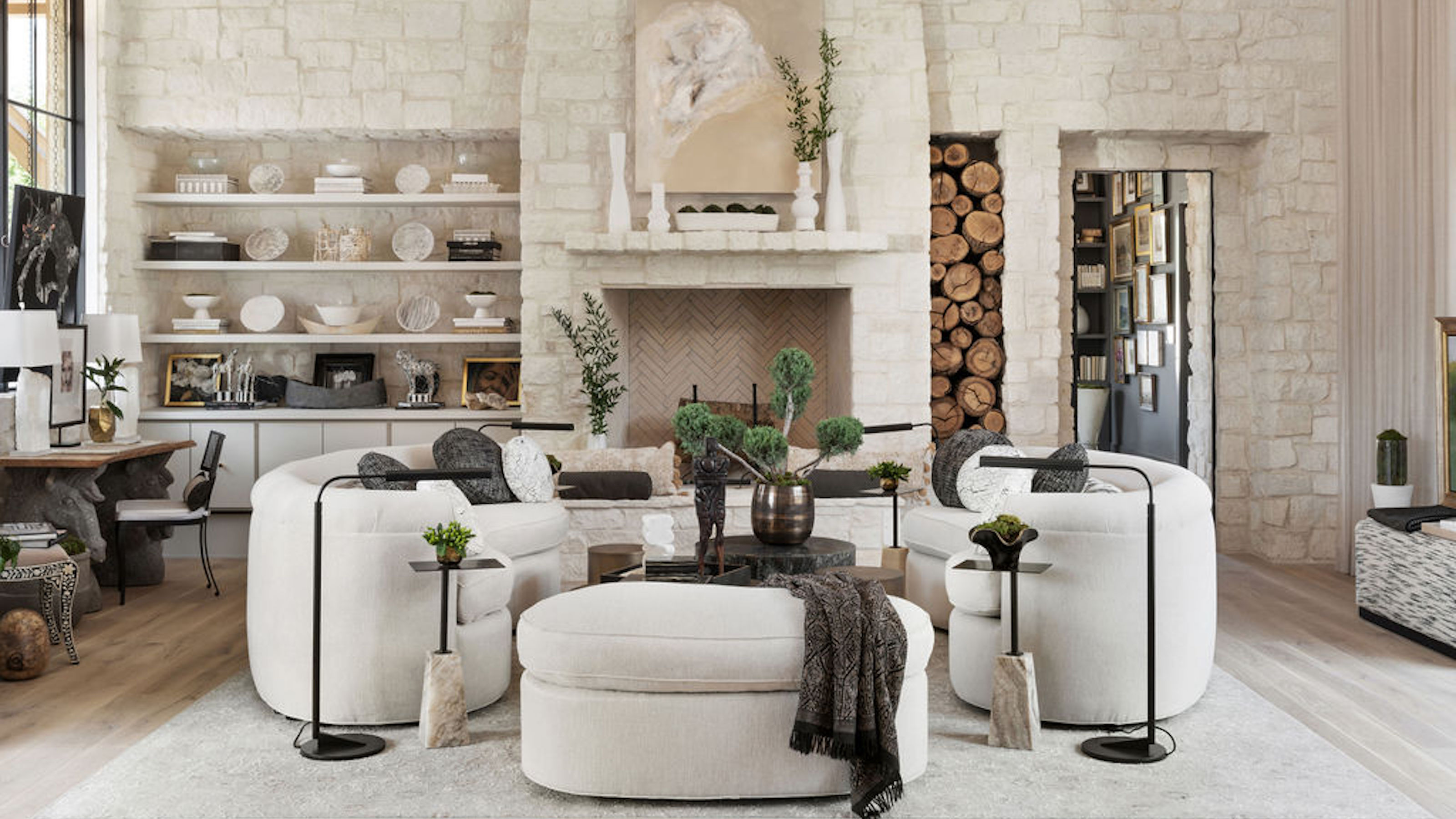 Elegant living room with stone fireplace and built-in shelves