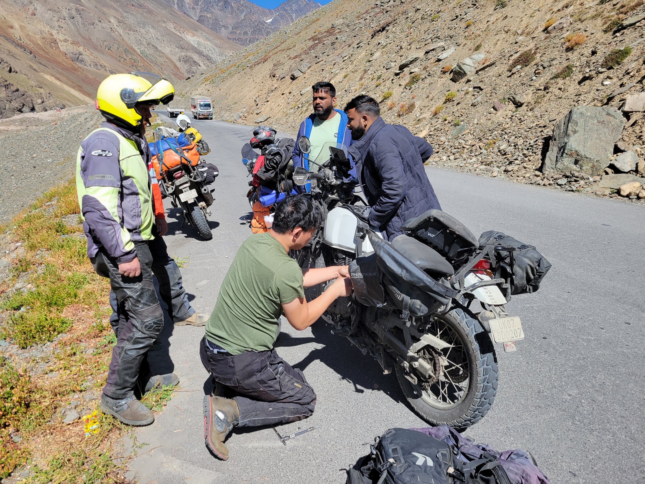 Motorcyclist riding a Himalayan mountain road in Uttarakhand