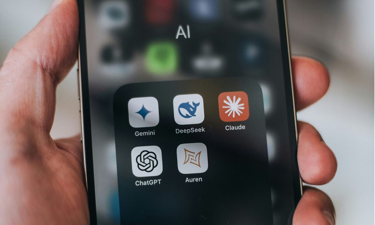A phone screen crowded with AI assistant apps, where most LLM stock analysis starts