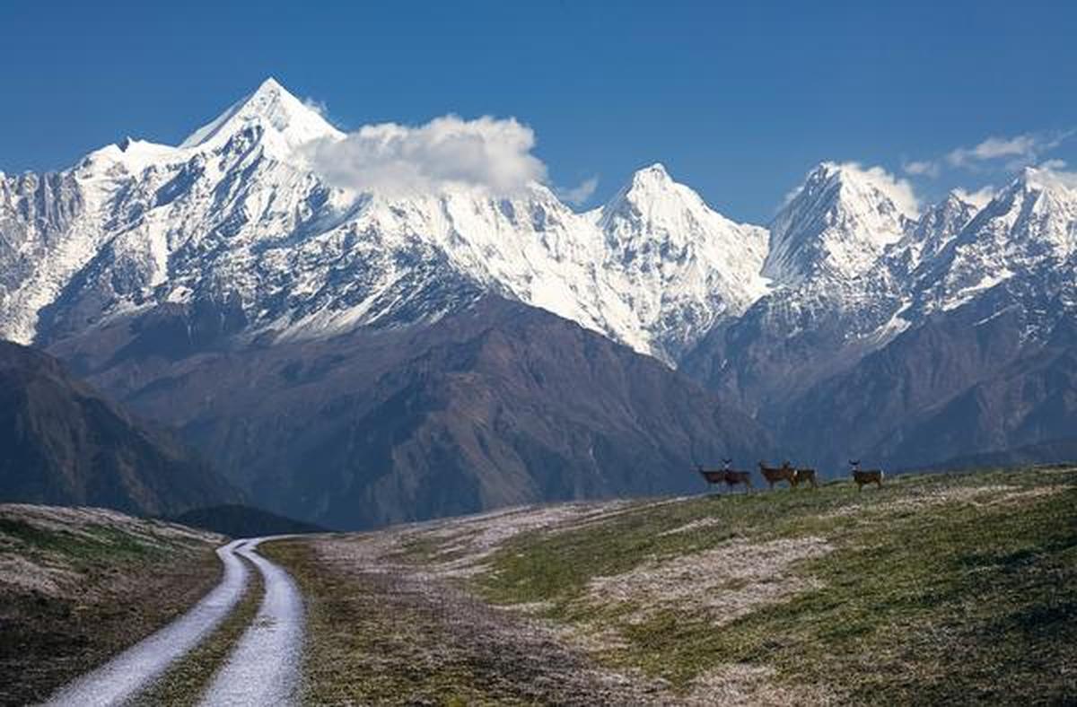 High Himalayan pass road with prayer flags