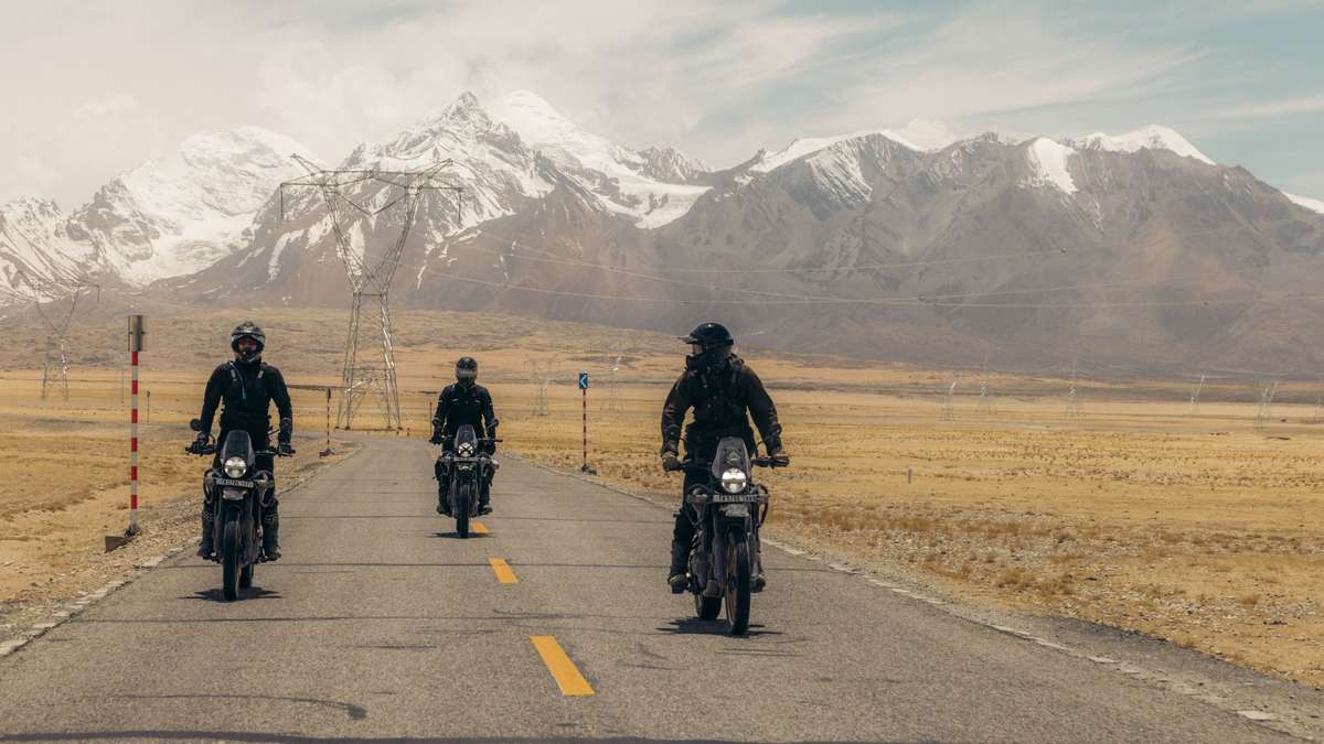 Motorcycle on a Himalayan road at sunrise