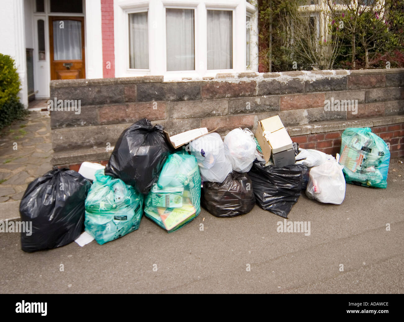 Trash bins and rubbish bags ready for collection in Dubai