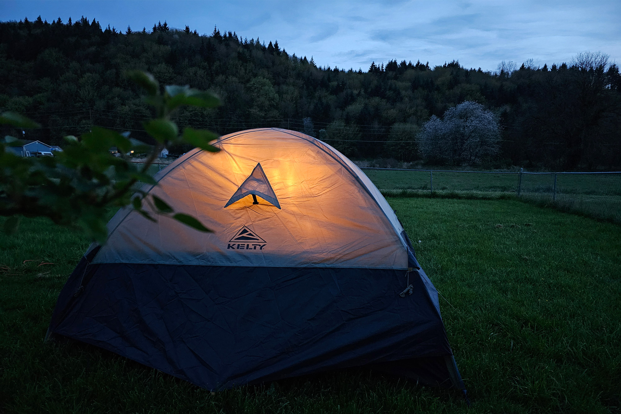 Camping tents glowing at dusk in the Himalayan mountains