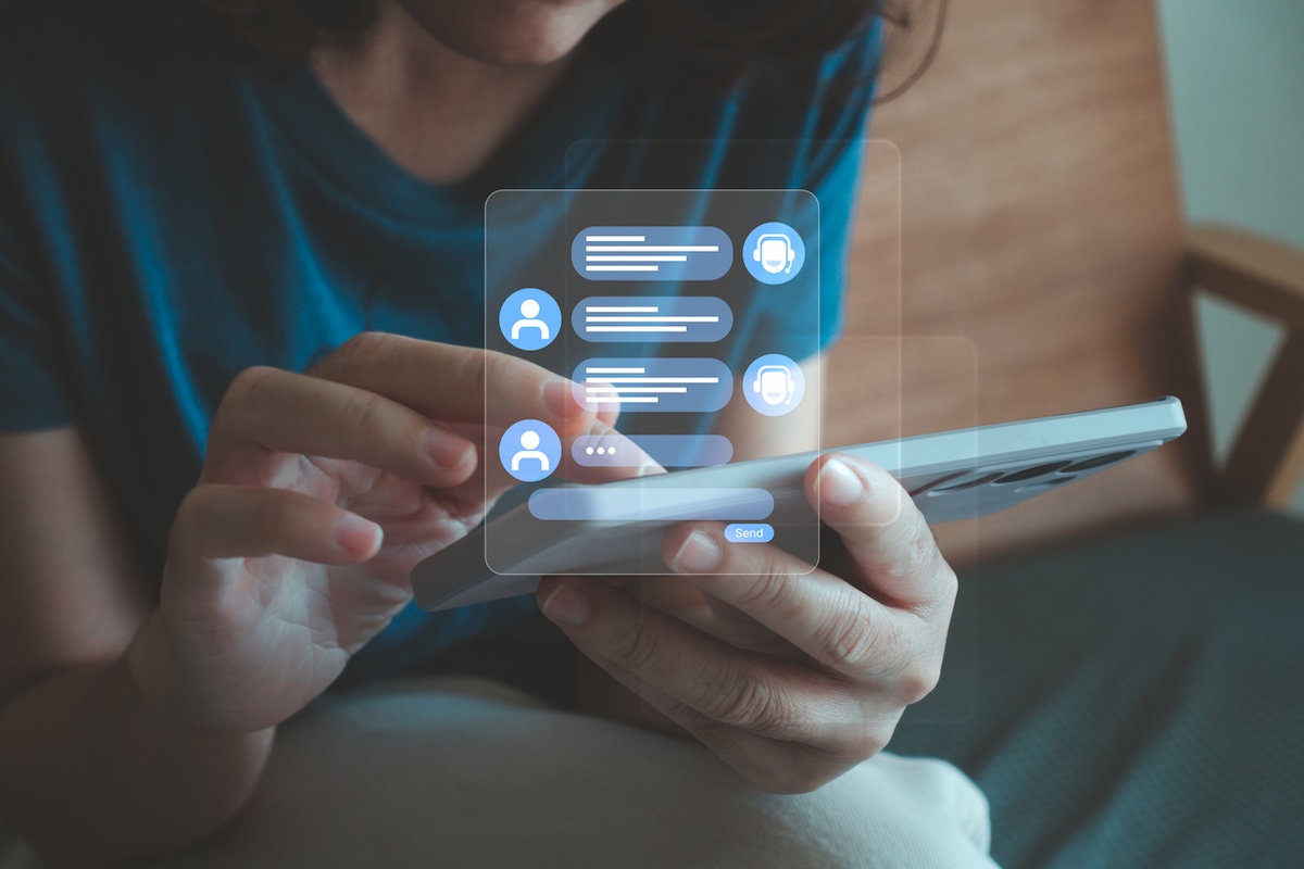 A tablet showing an AI conversation while a user cross-checks the answers