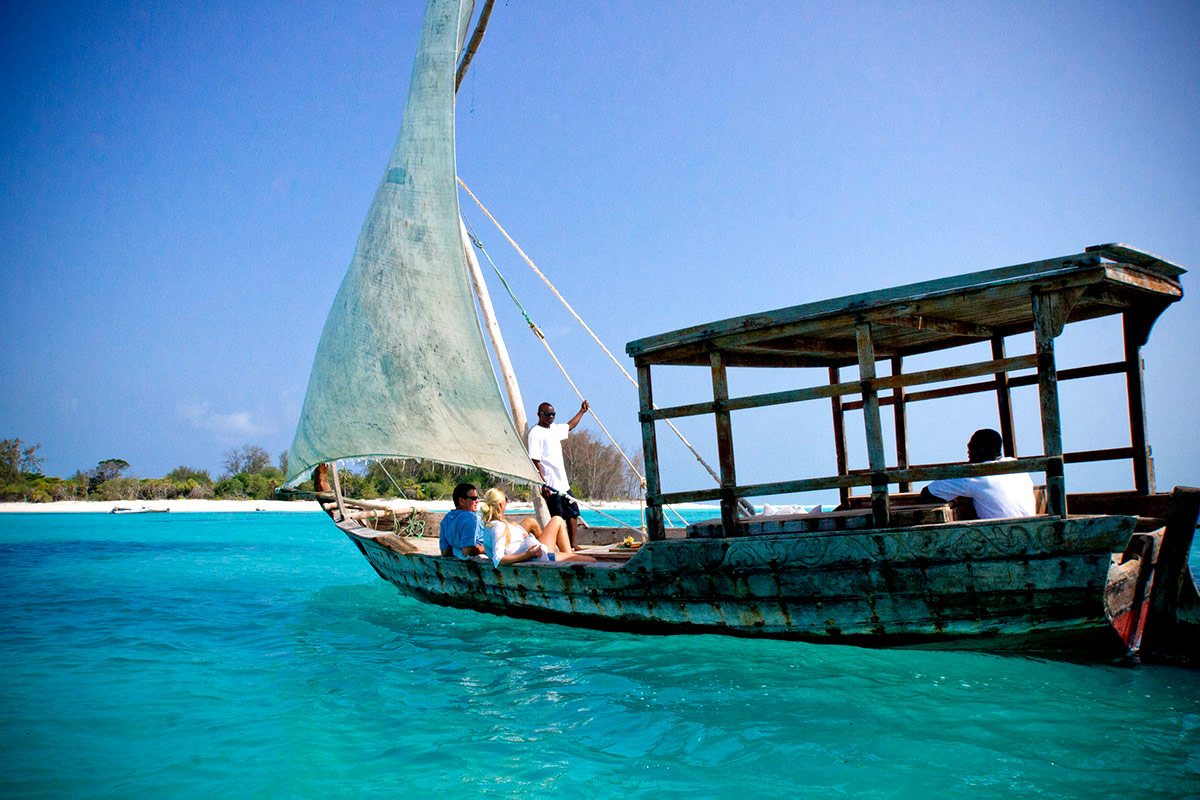 A dhow on turquoise water off Zanzibar