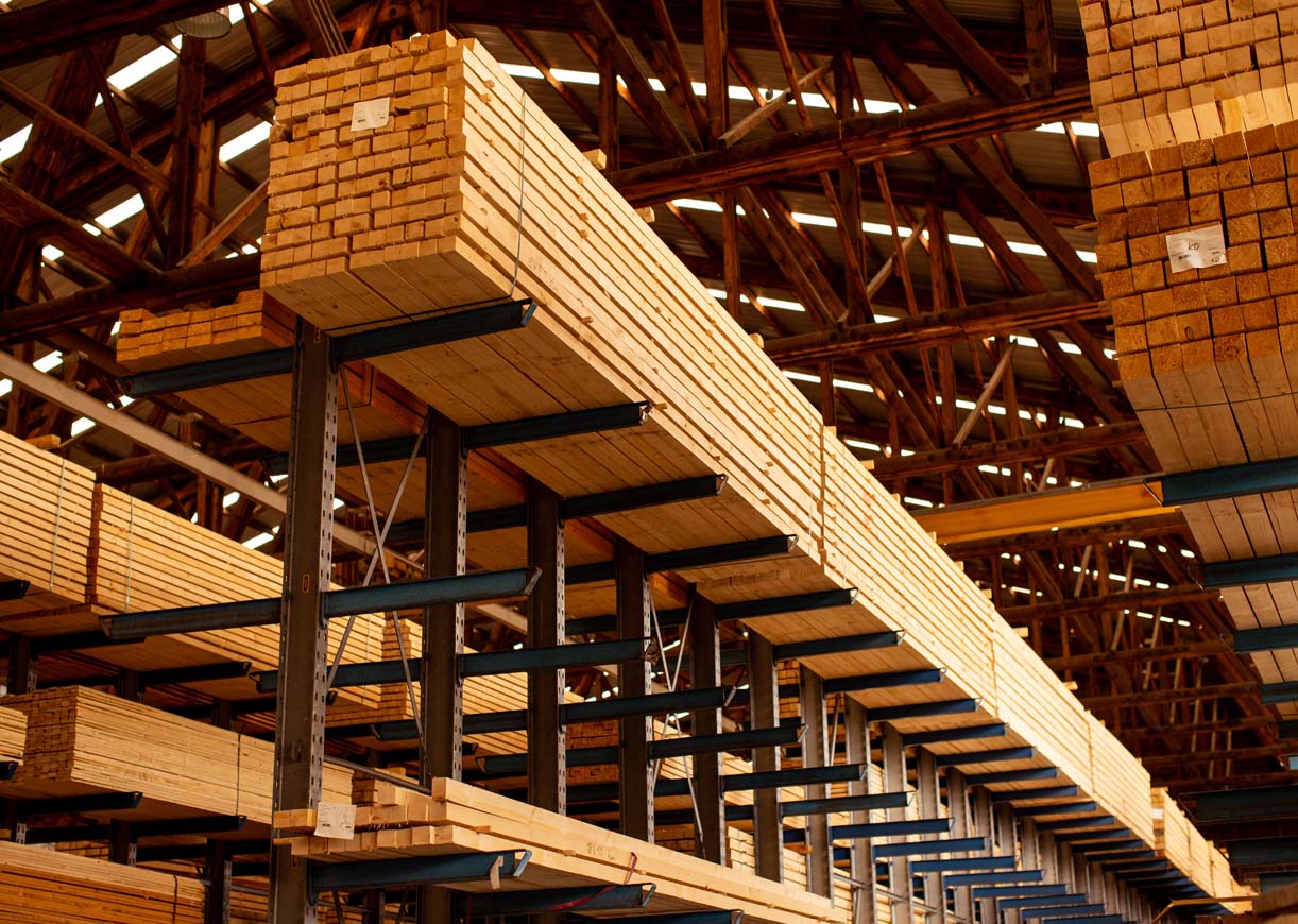 Lumber warehouse with stacked timber planks in Denmark