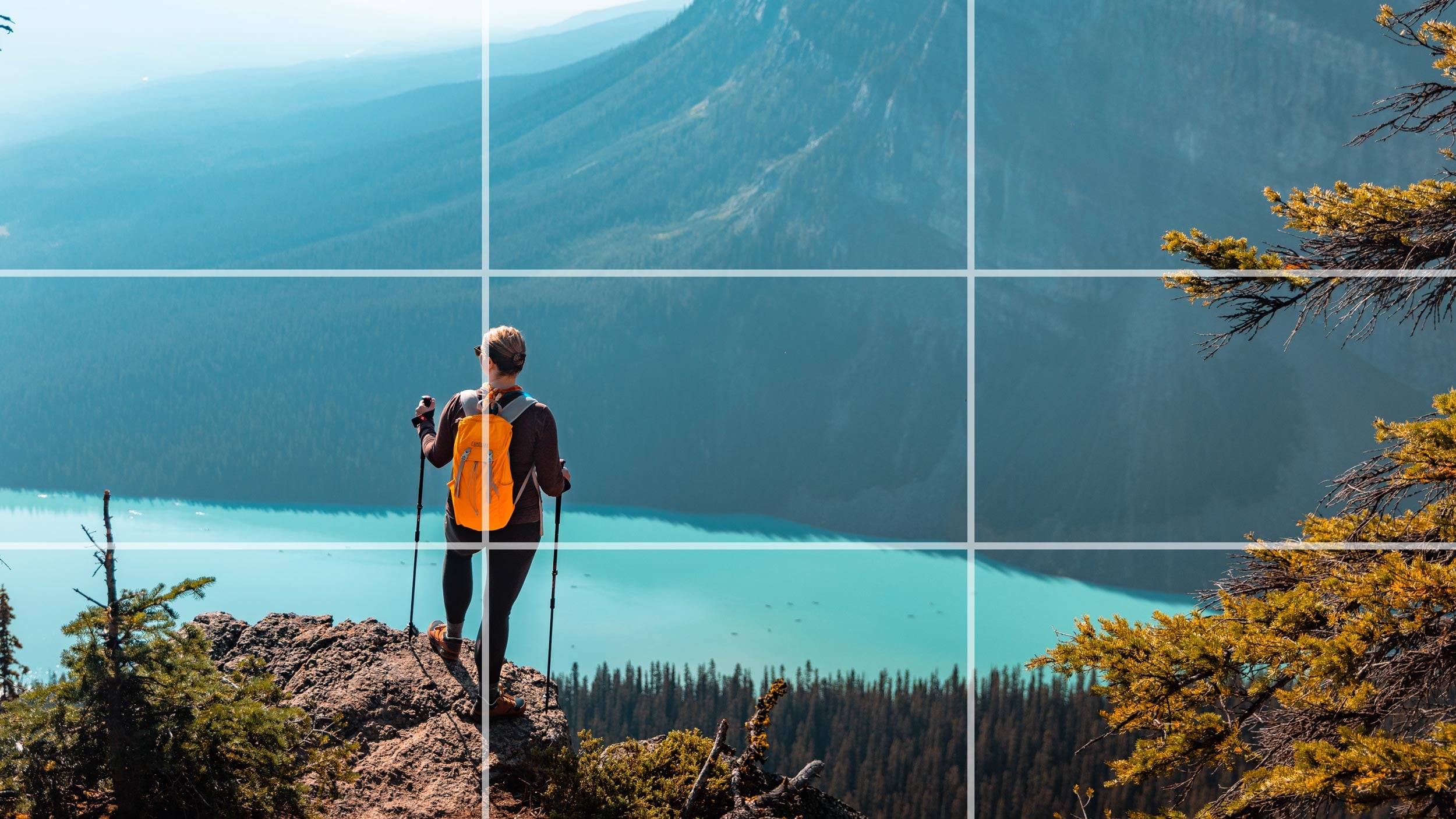Landscape photograph with a rule-of-thirds grid overlay showing the hiker on an intersection