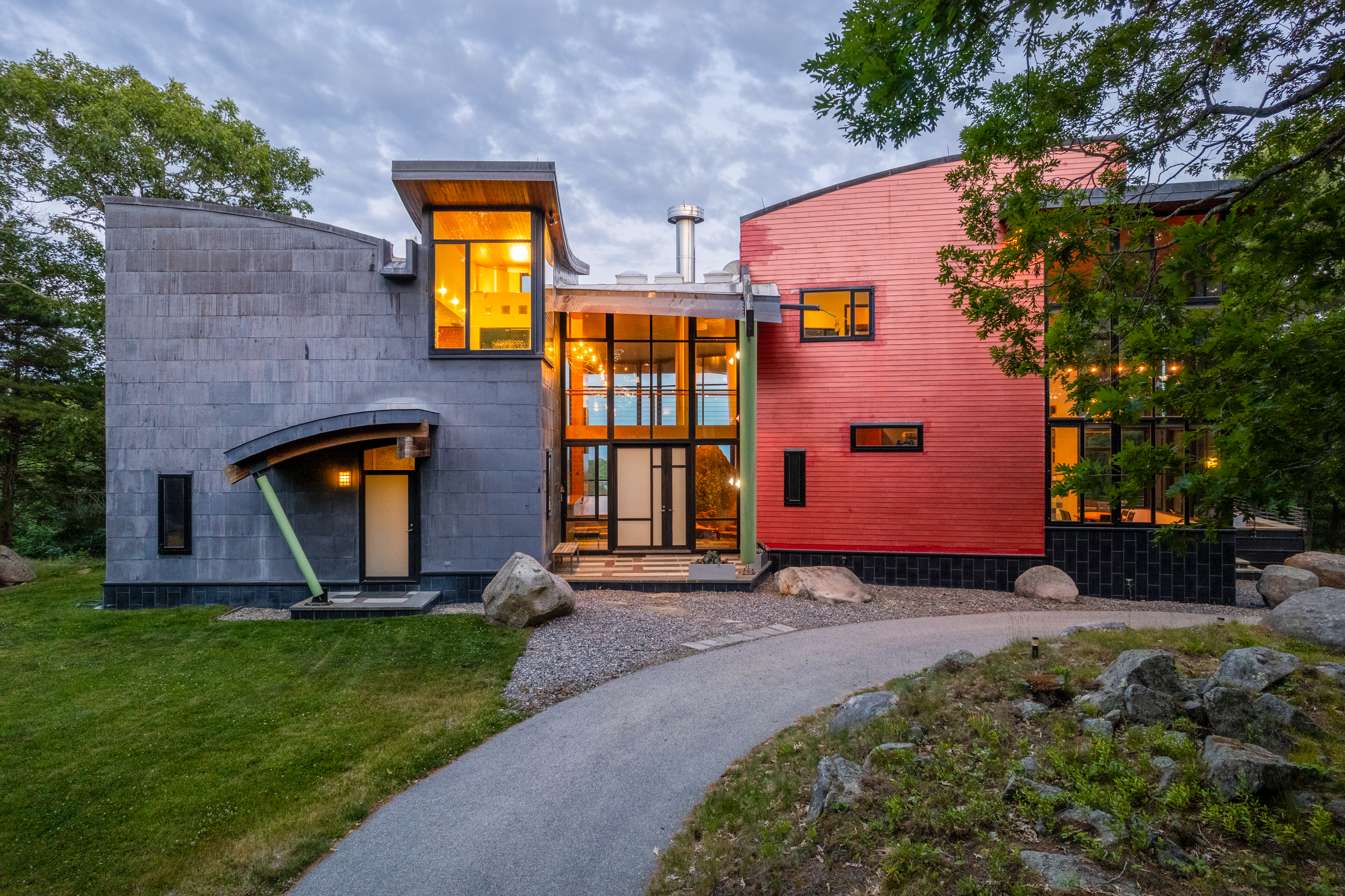 Contemporary stone residence glowing at twilight