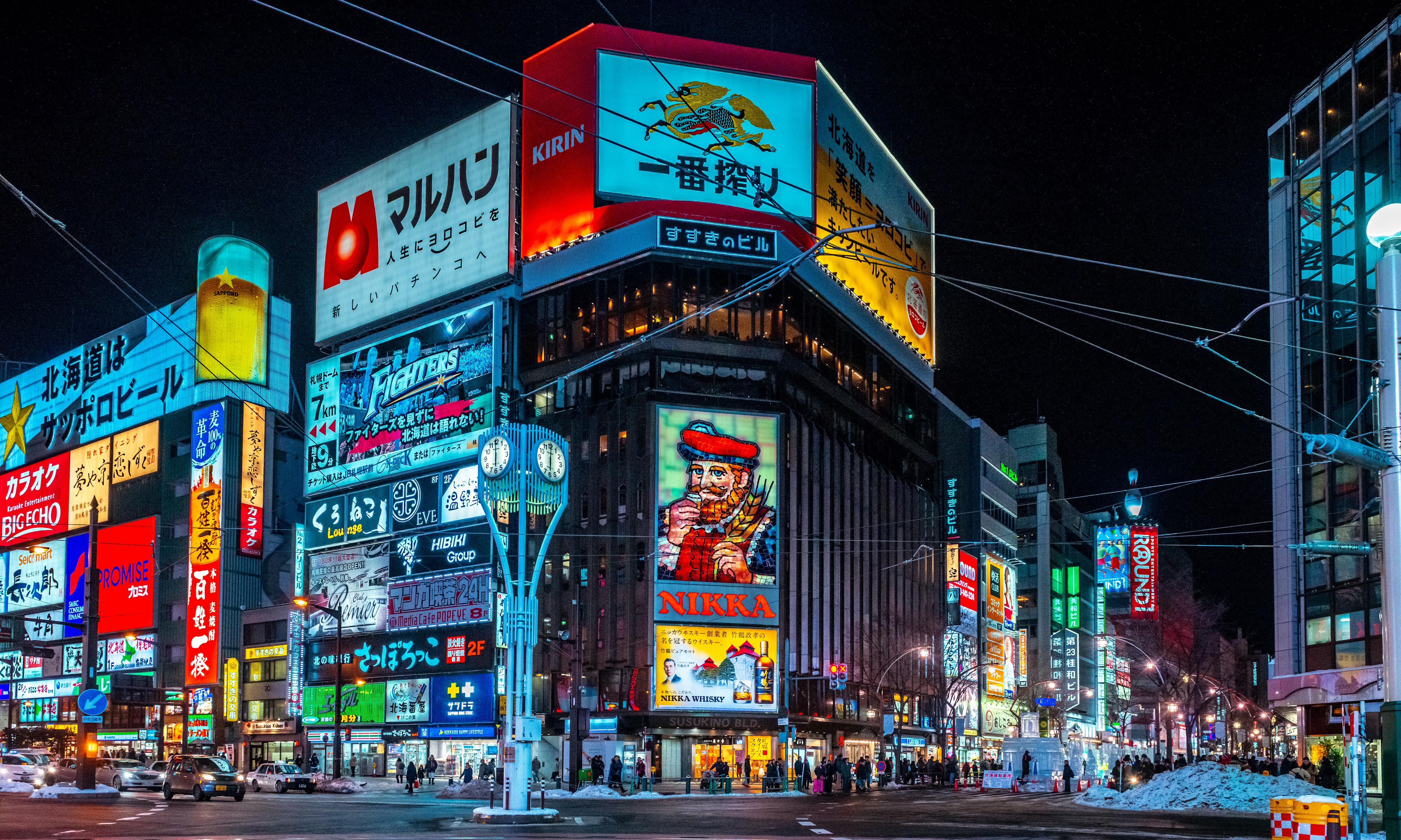 City billboards glowing through winter night streets, the seasonal advertising stage where the AI Christmas ad debuted